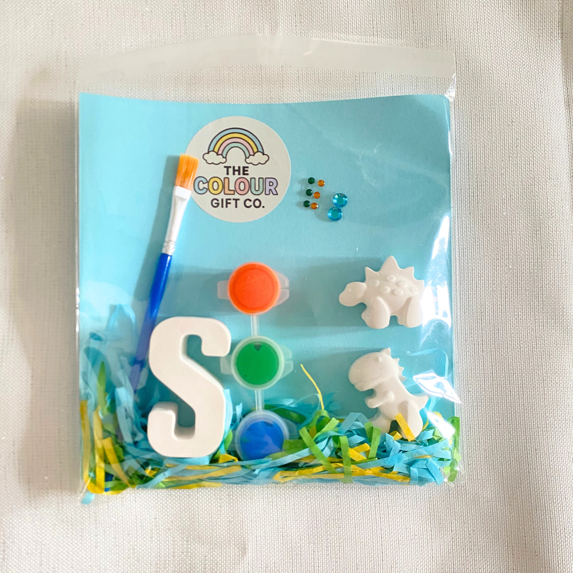 Triceratops mini paint kit with dinosaur moulds, paints, an initial and brush