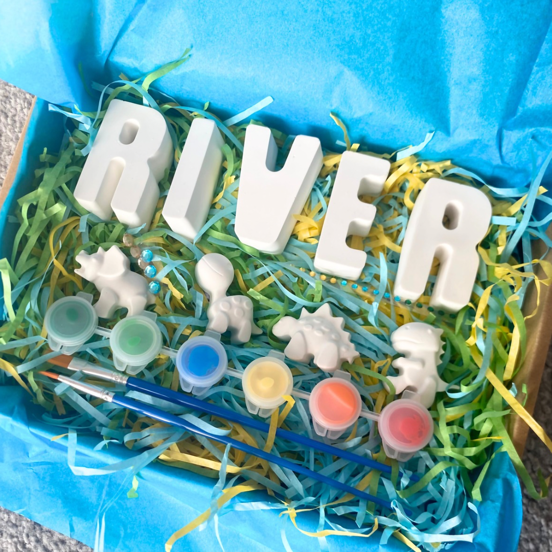 Children’s personalised paint kit with the name spelt River and 4 themed dinosaur moulds which also includes 6 colourful paints and stickers. 
