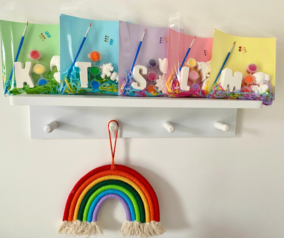 Collection of personalised mini paint kits in different themes with initials, plaster shapes and paints from The Colour Gift Co.